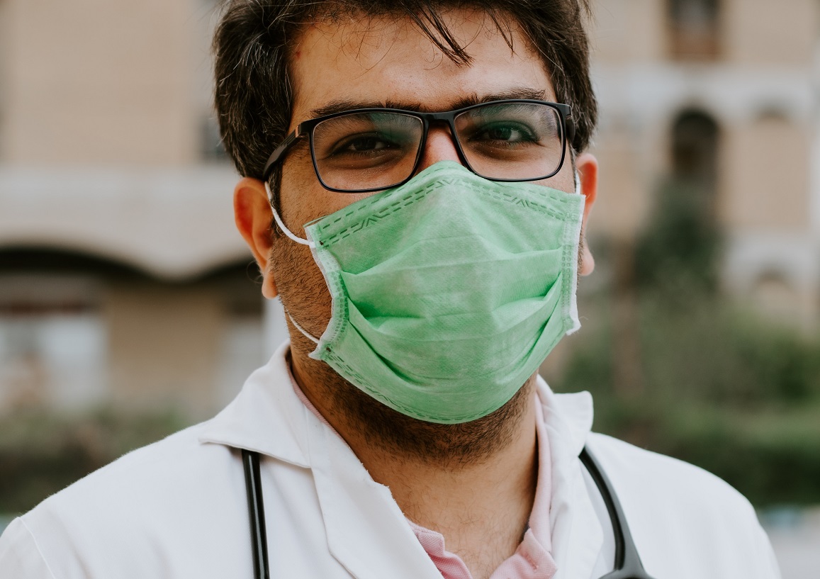 Doctor with a green face mask