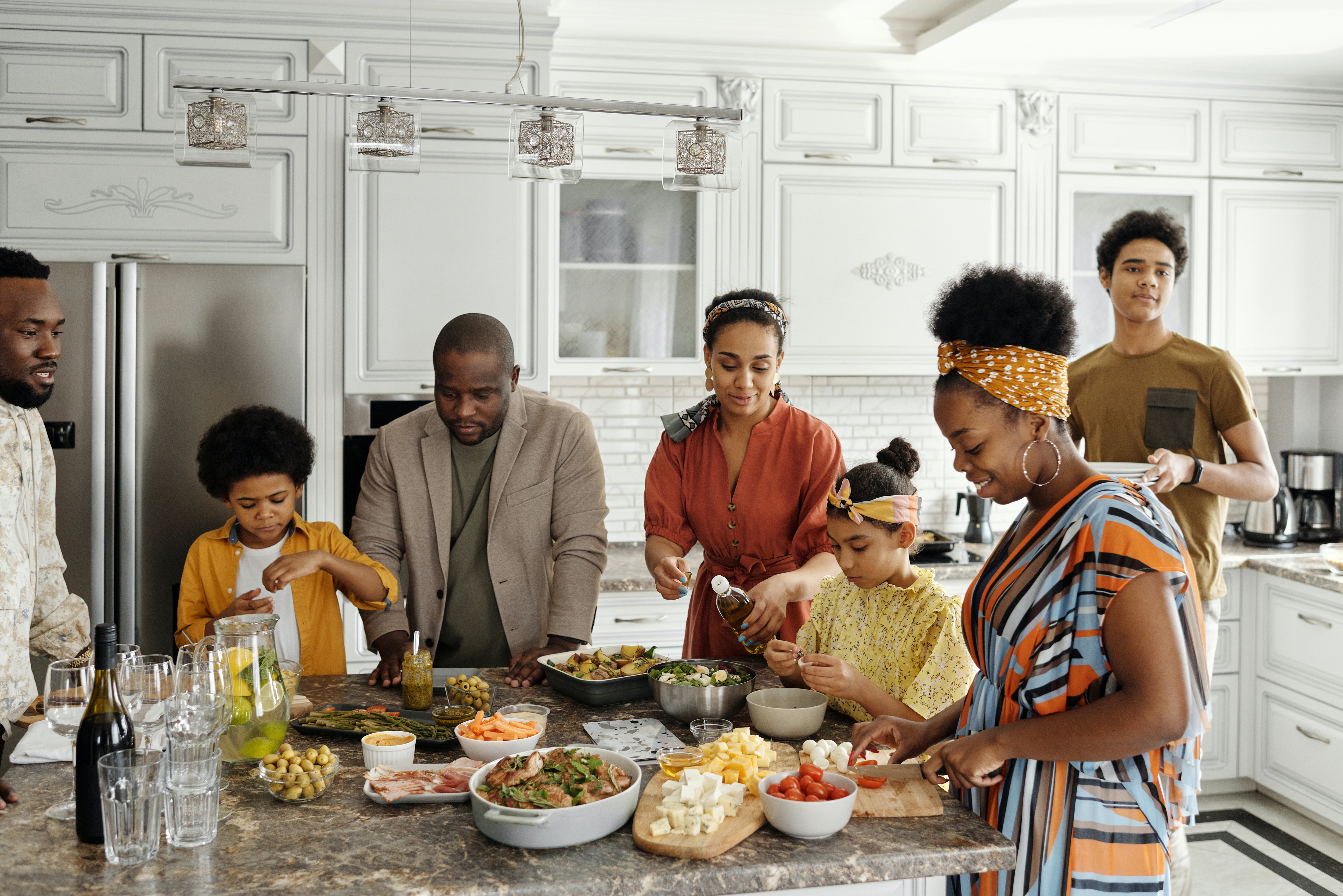 Family Gathered around a kitchen counter