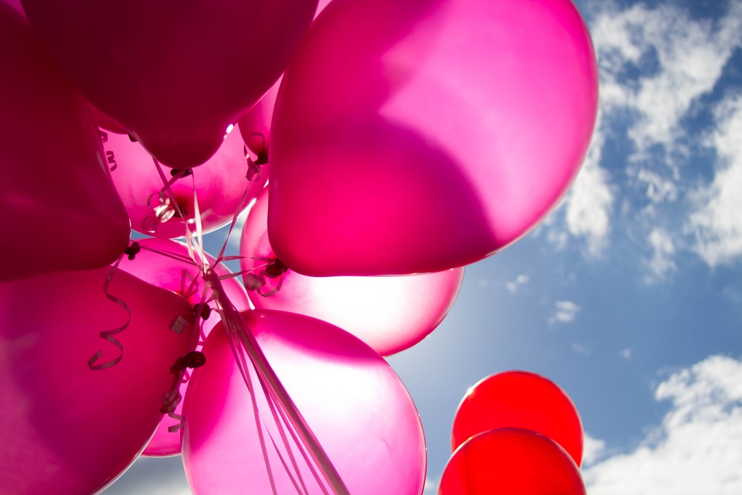 Pink balloons facing the sky