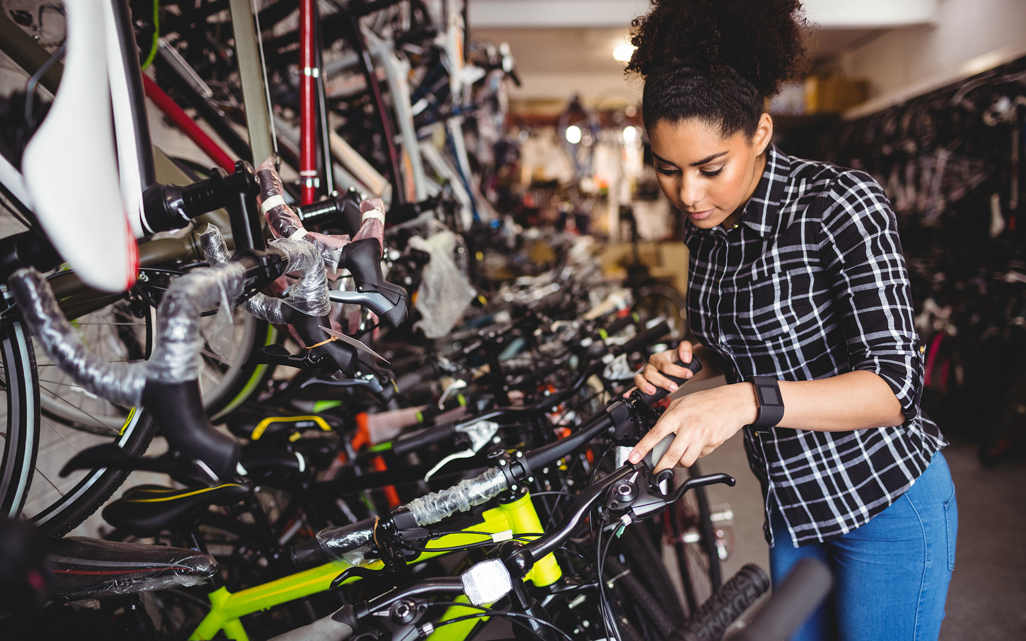 person examining bikes in a bike shop