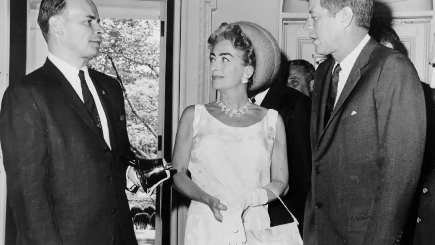 Frank Proctor, Board Chair for the National Mental Health Association, Joan Crawford, and President Kennedy