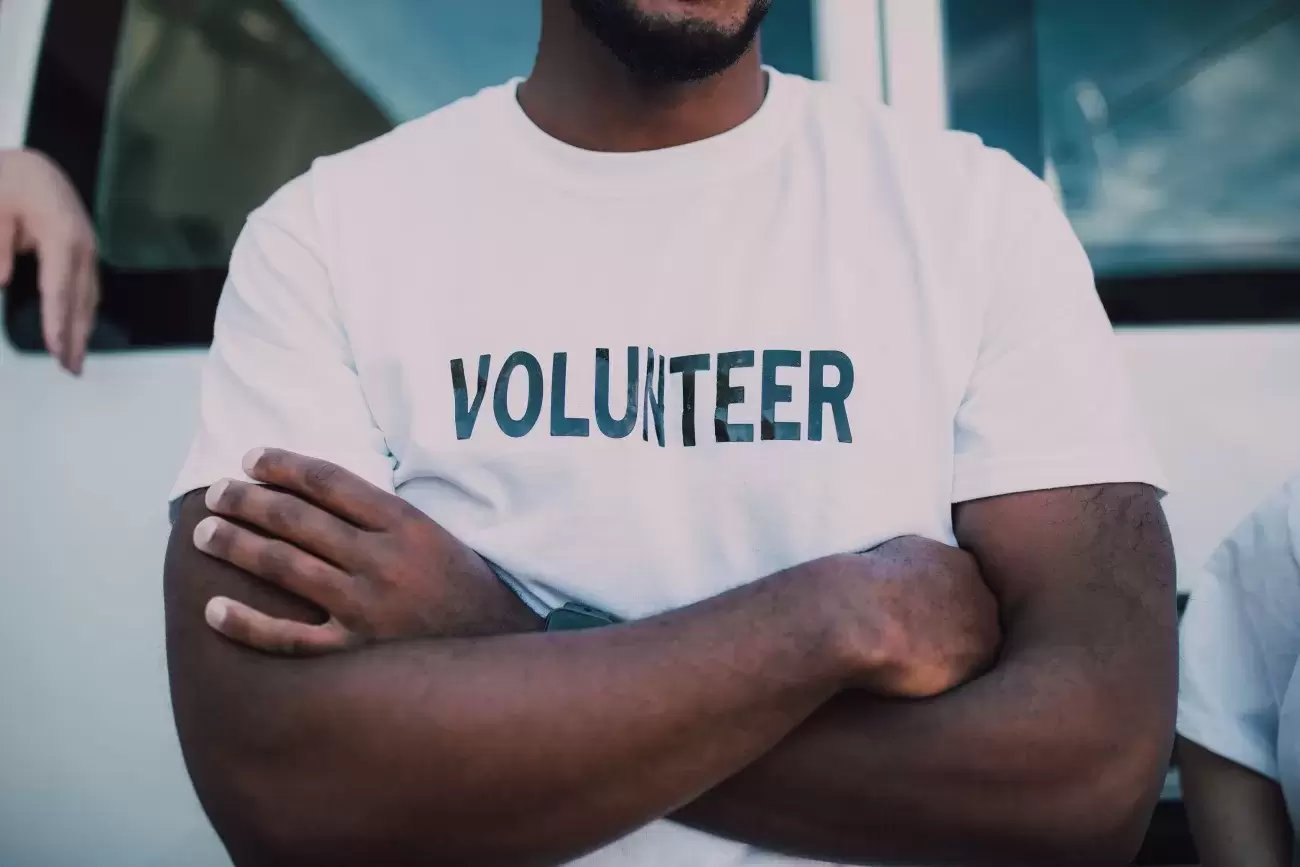 chest of a person wearing a shirt with "VOLUNTEER" on it