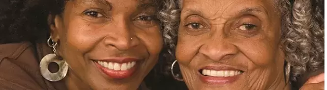 two women smiling at camera