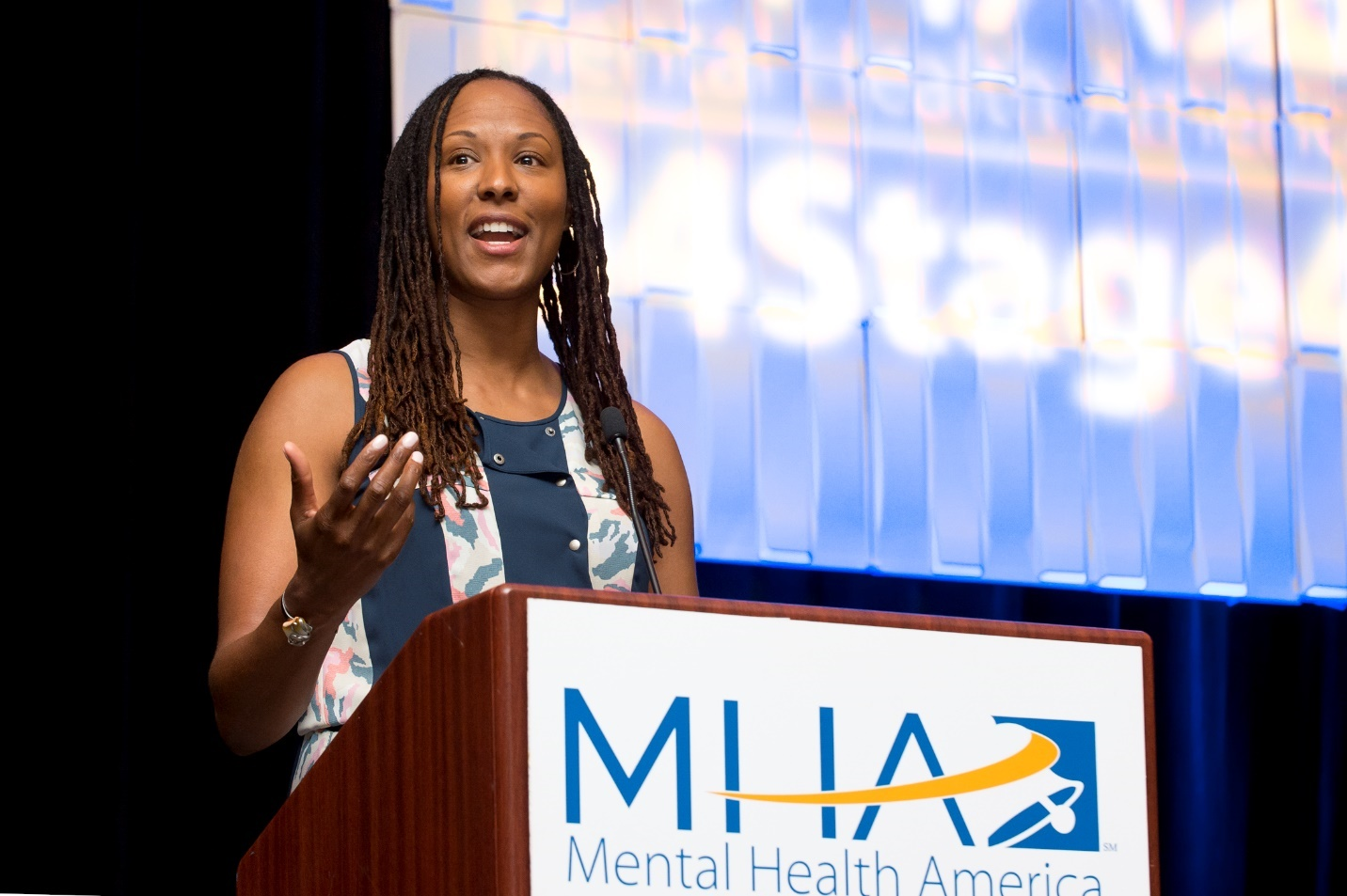 Chamique Holdsclaw speaks at an MHA podium